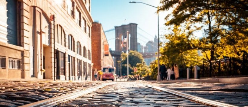 A close-up on NYC cobblestones, with the Brooklyn Bridge in the distance. Moving to New York means you see this stuff daily.